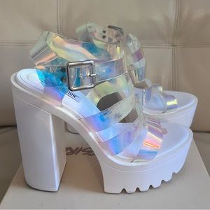 Clear plastic platform sandals.